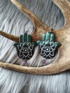 Hamsa-korvakorut, sininen/musta metallinhohto